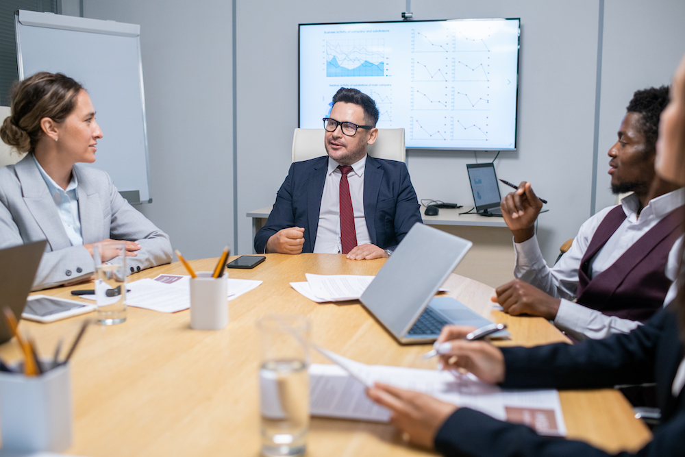 large-group-of-colleagues-listening-to-explanation-2021-10-13-02-02-43-utc (1)